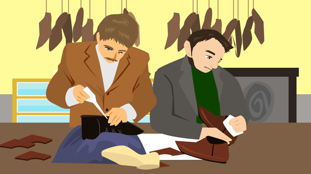 テーブルで仕事しているふたりの靴修理職人