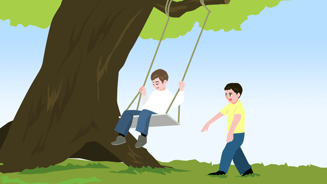 巨大な樫の木に吊るされたブランコで遊ぶ子どもたち
