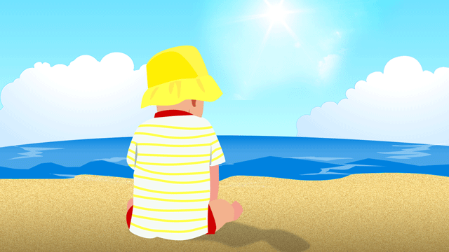 日除け帽で頭を守りながらビーチで遊んでいる子どもたち