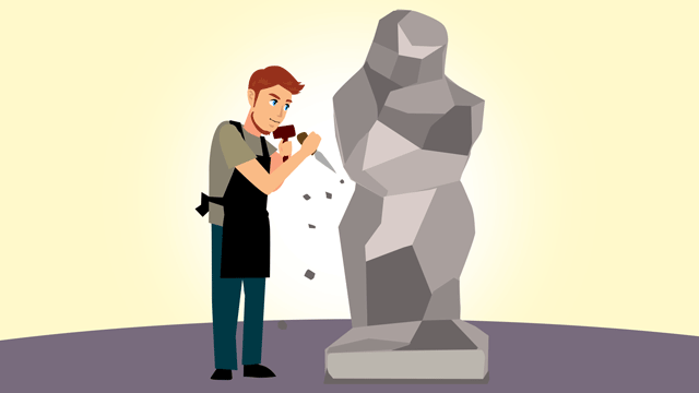 仕事している彫刻家