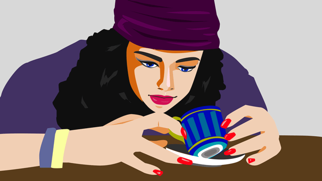 お茶の葉を読んでいる女