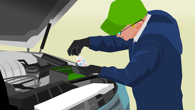 水圧計(ハイドロメーター)を使って車のバッテリーを検査している自動車修理工